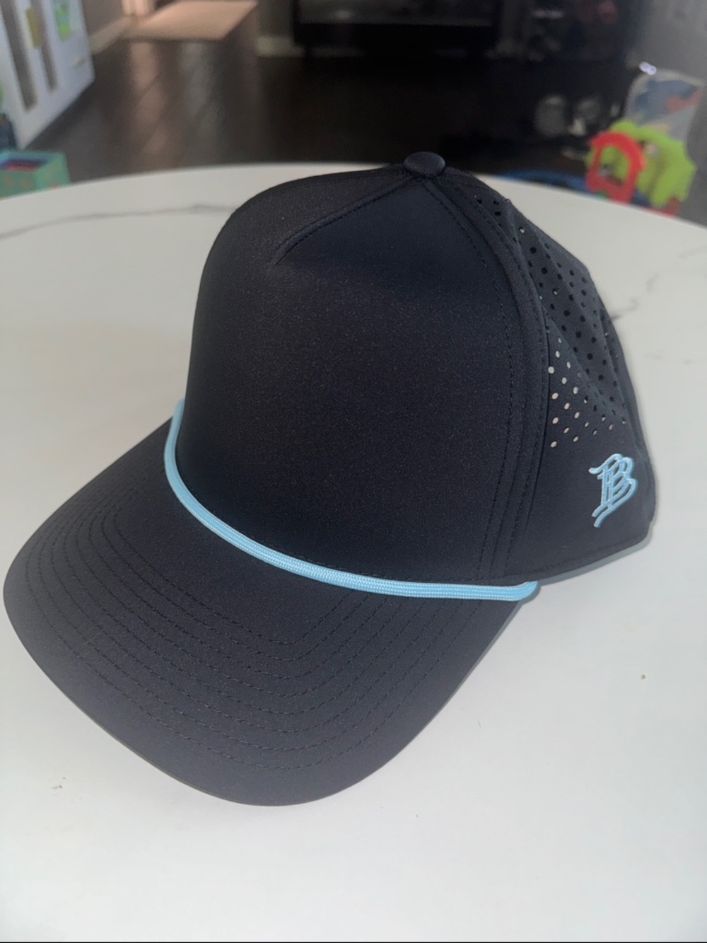 Black snapback with Light Blue Trim and Embroidered Logo